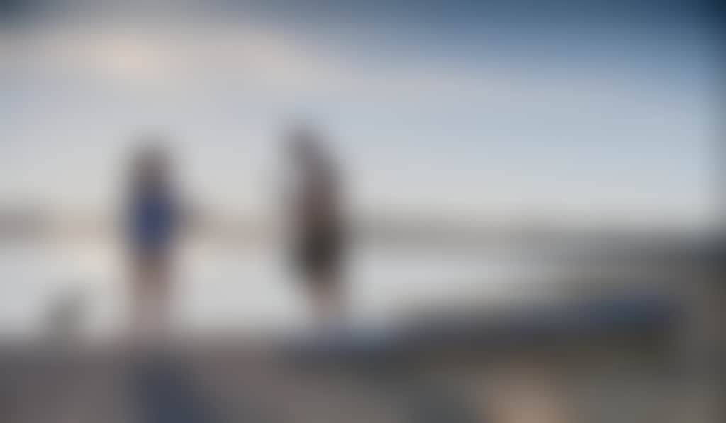 Young attractive couple Stand Up Paddle