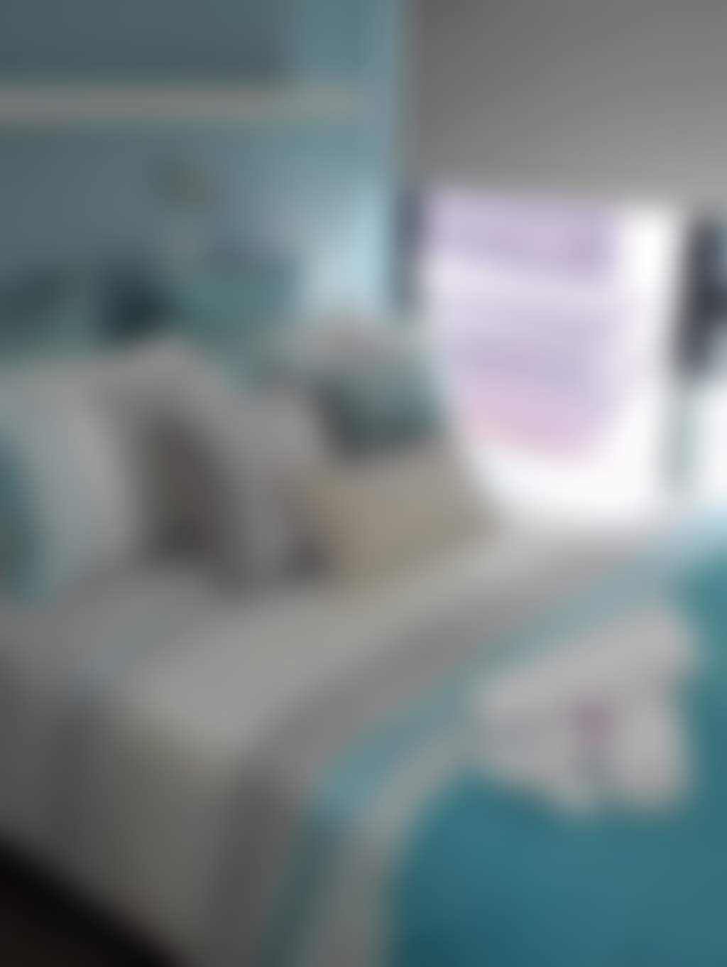 Comfy queen bedroom themed with blue and white interior decorations