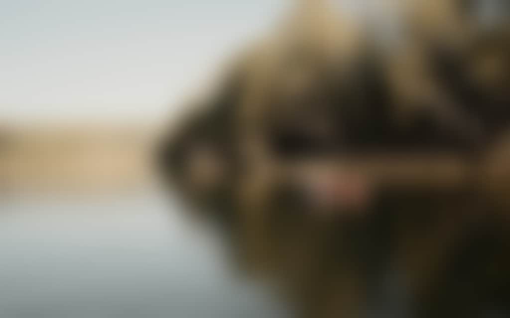 Two people in a red canoe on the Murrya River