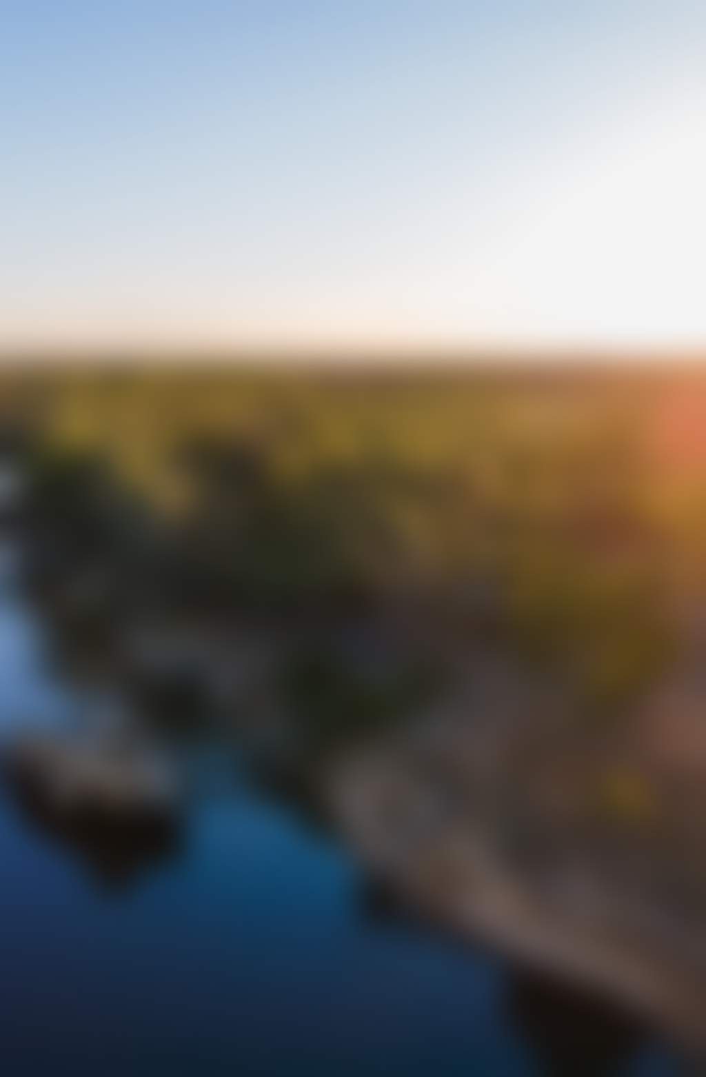 Scenic view of a paddlesteamer cruising down the Murray River with the sun shining