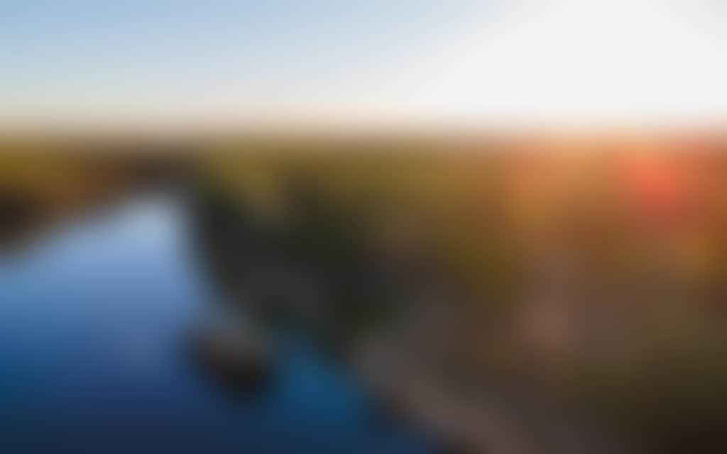 Scenic view of a paddlesteamer cruising down the Murray River with the sun shining