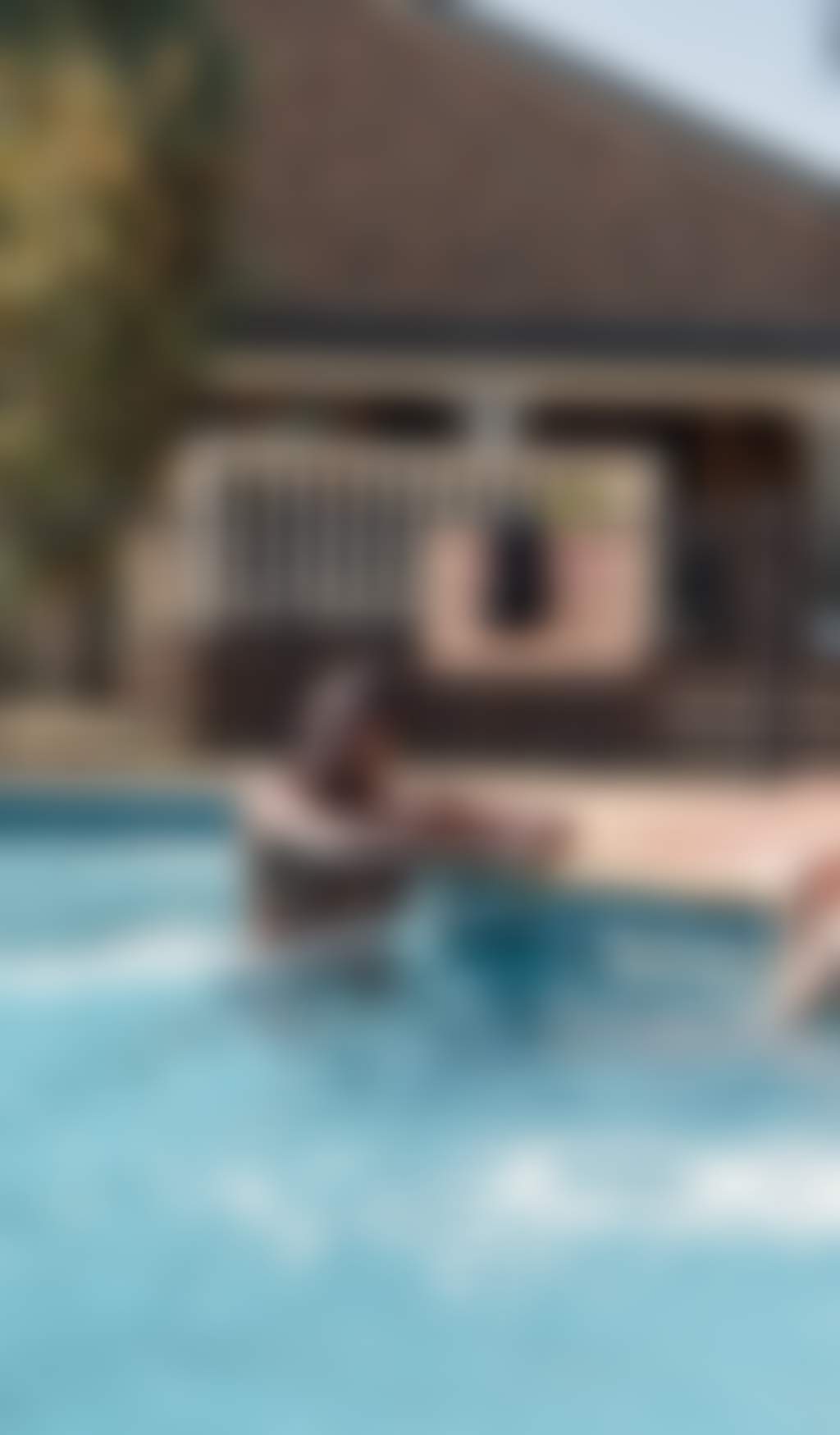 Resized Young attractive couple chill in the pool of their motel in Echuca Moama