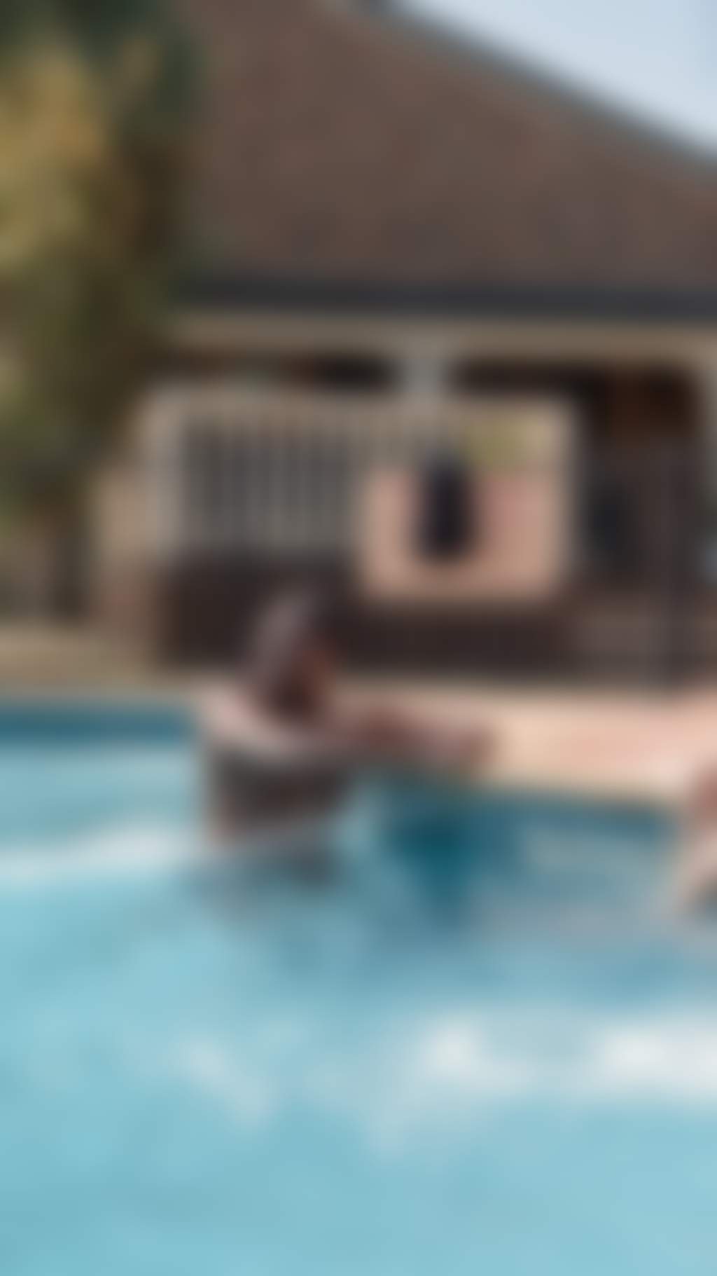 Resized Young attractive couple chill in the pool of their motel in Echuca Moama