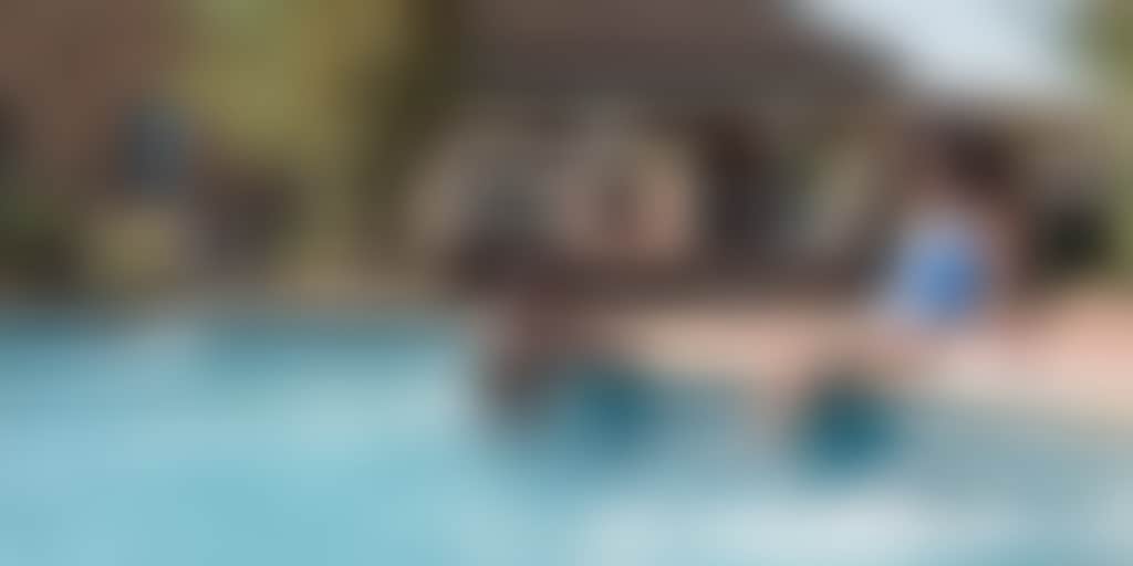 Resized Young attractive couple chill in the pool of their motel in Echuca Moama