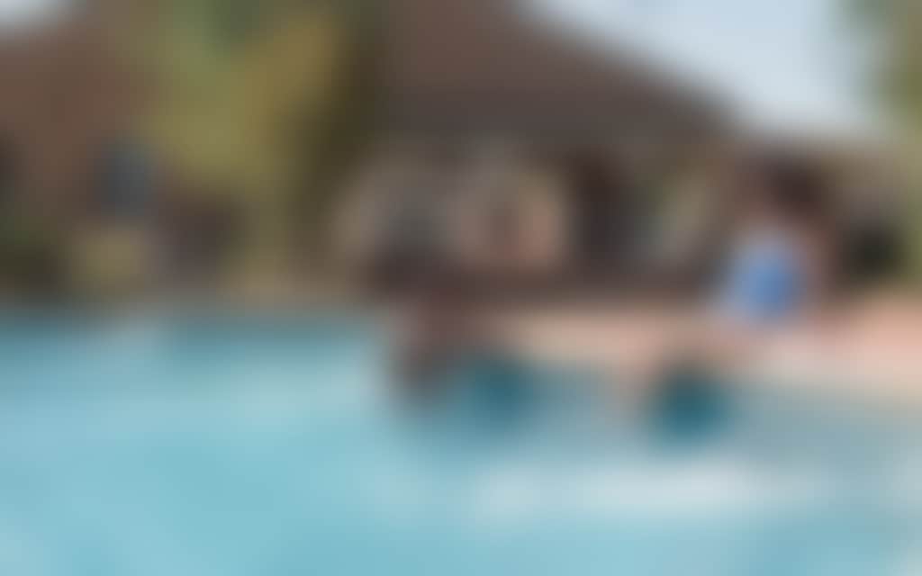 Resized Young attractive couple chill in the pool of their motel in Echuca Moama