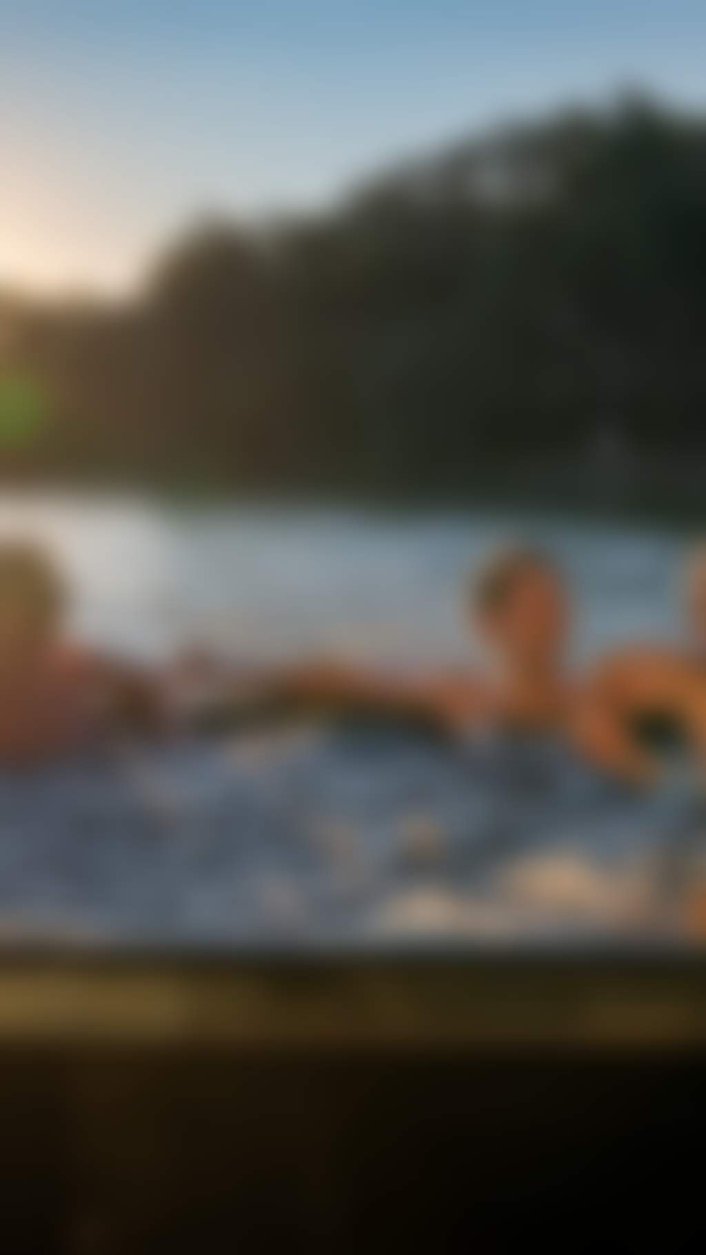 Resized Group of friends chilling in a hot tub on a houseboat