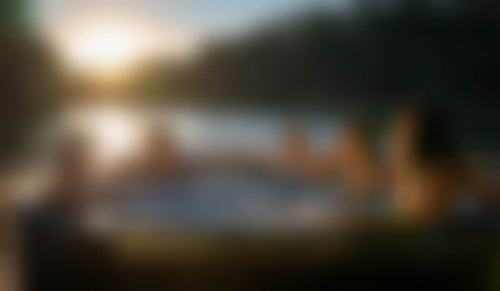 Resized Group of friends chilling in a hot tub on a houseboat