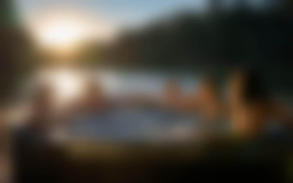Resized Group of friends chilling in a hot tub on a houseboat
