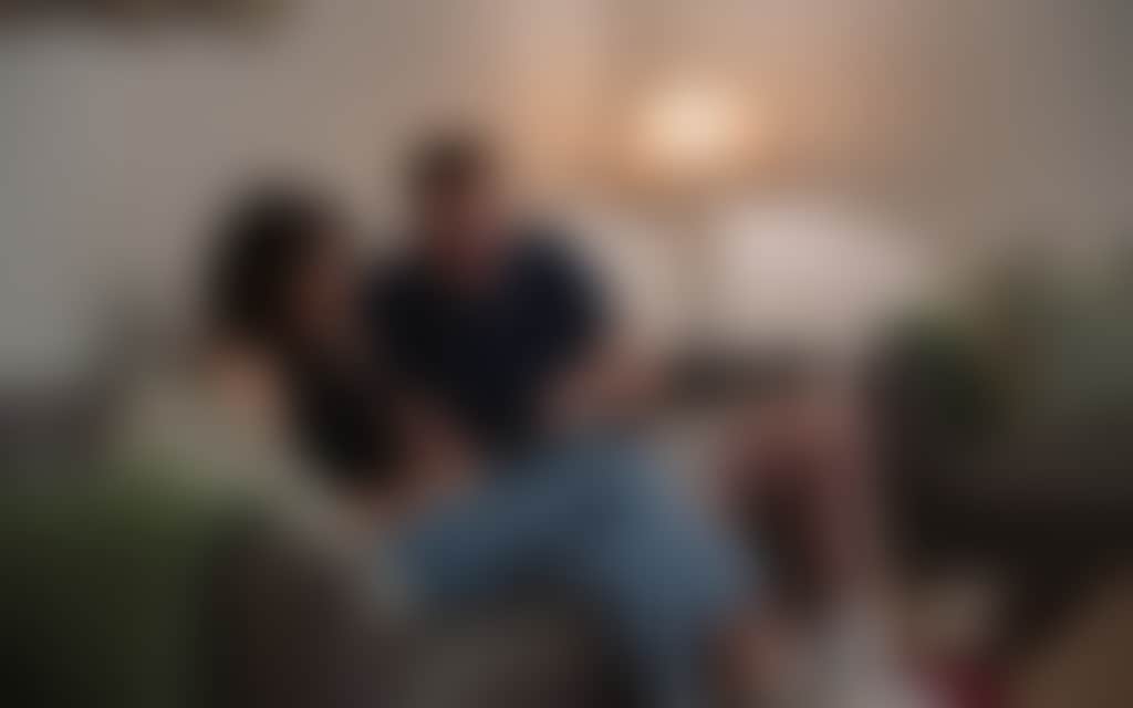 Resized Mature couple sitting on the couch in their charming air bnb