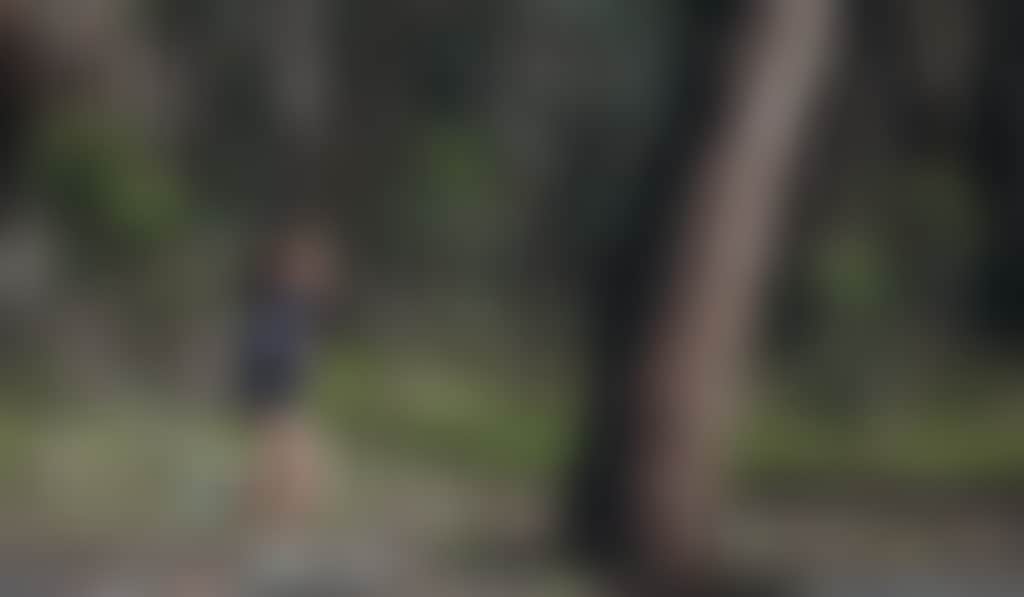 Young woman jogging through the forest in Echuca Moama