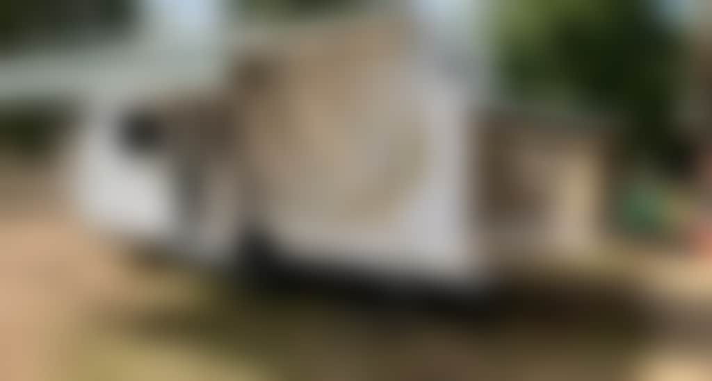 Allandi Caravan set up for camping during the summer months