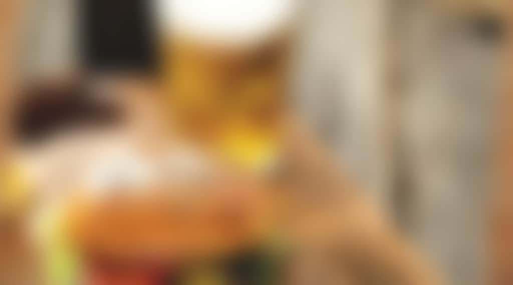 Burger and a beer on a wooden table