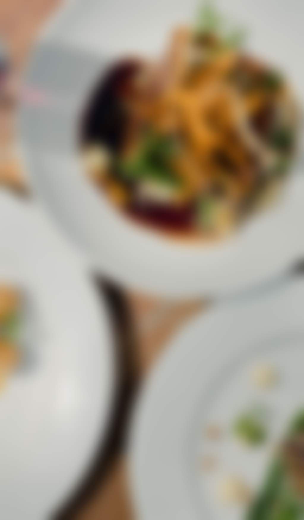Top view of three plates with different types of food
