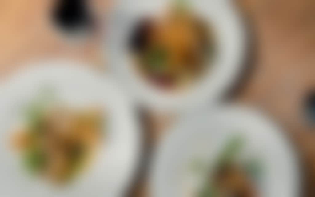 Top view of three plates with different types of food