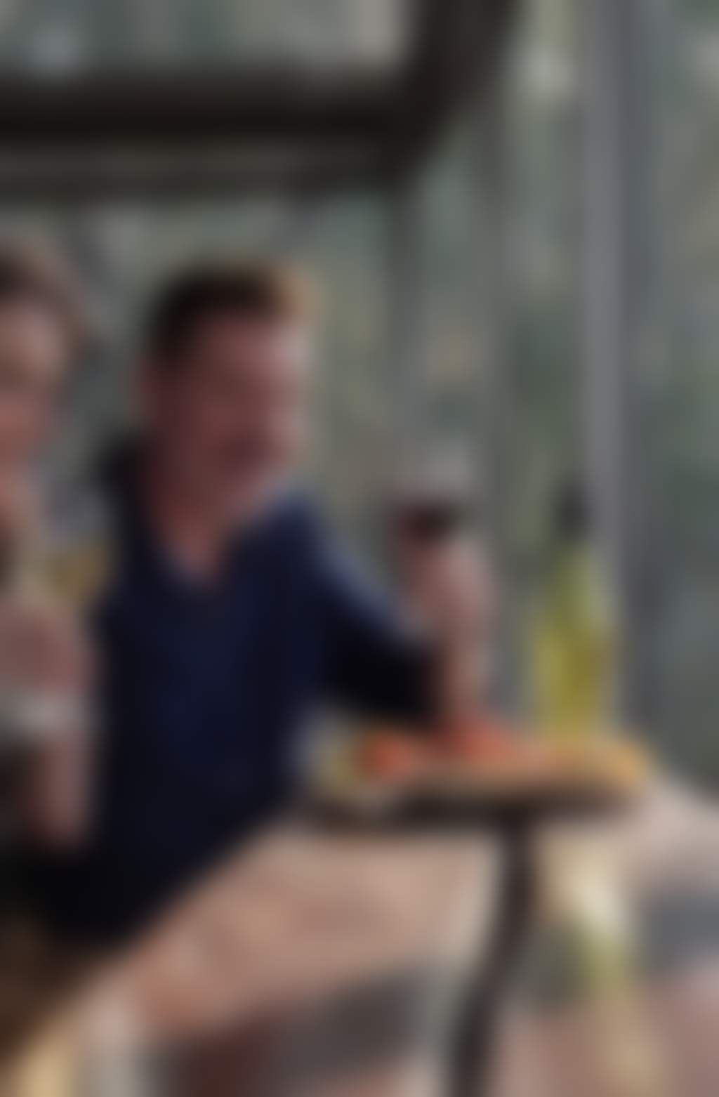 Resized mature couple drinking wine and eating cheese at a winery
