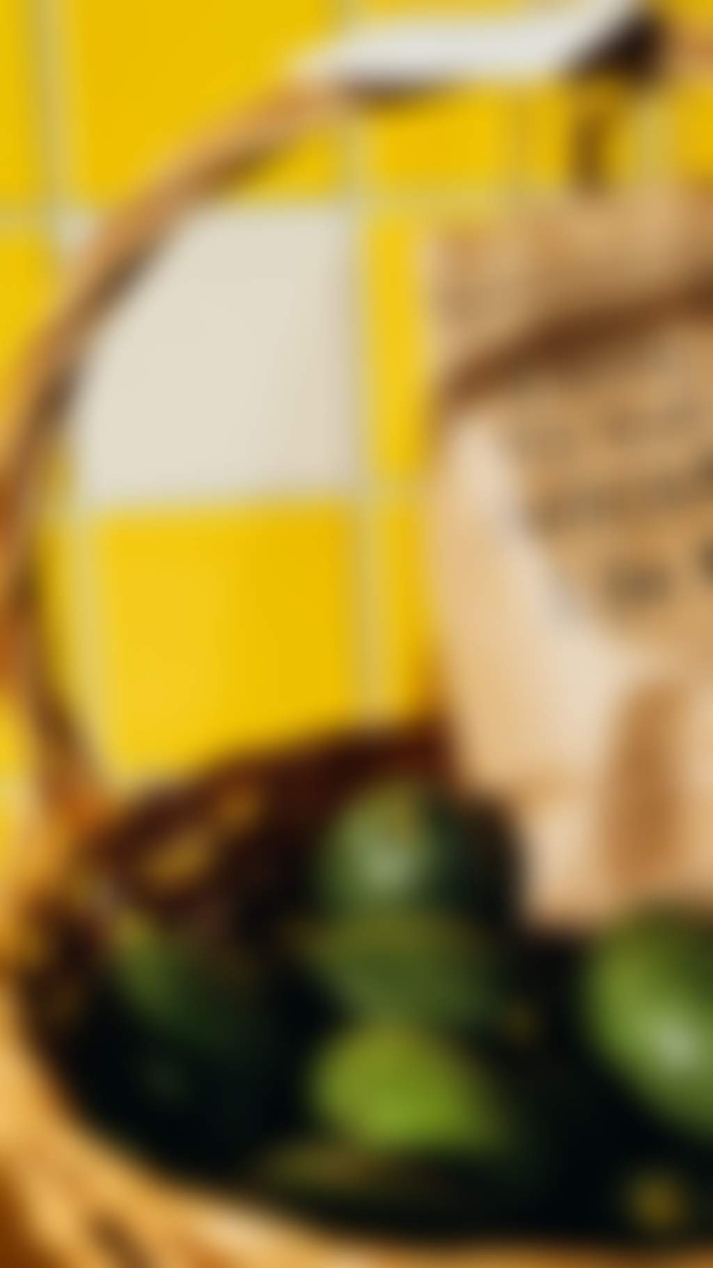 A basket of fresh local avocados