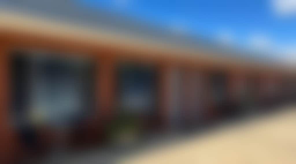 Motel facade with outside seating