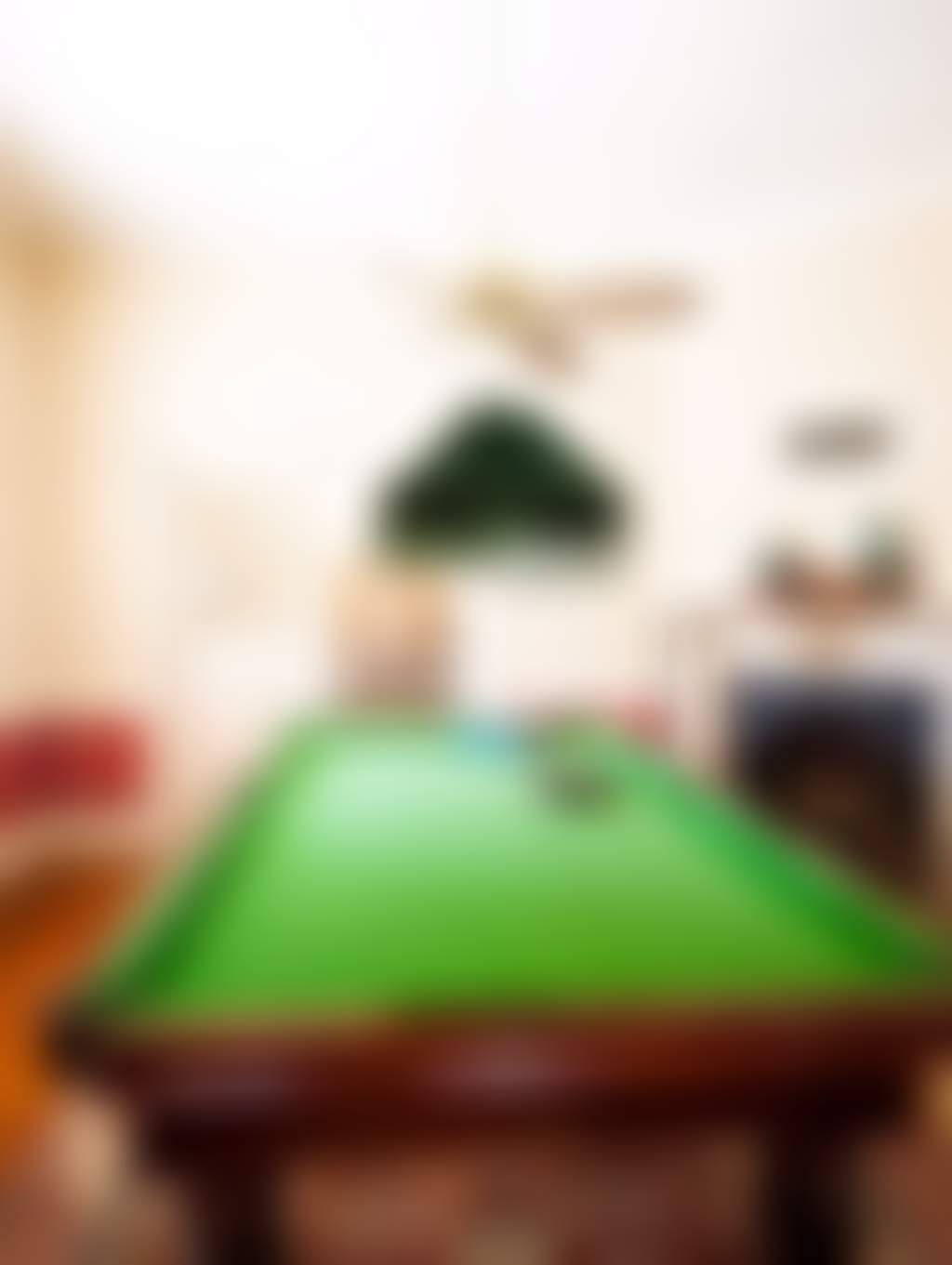 The billiards room of the Charleston house, complete with a beautiful fire place