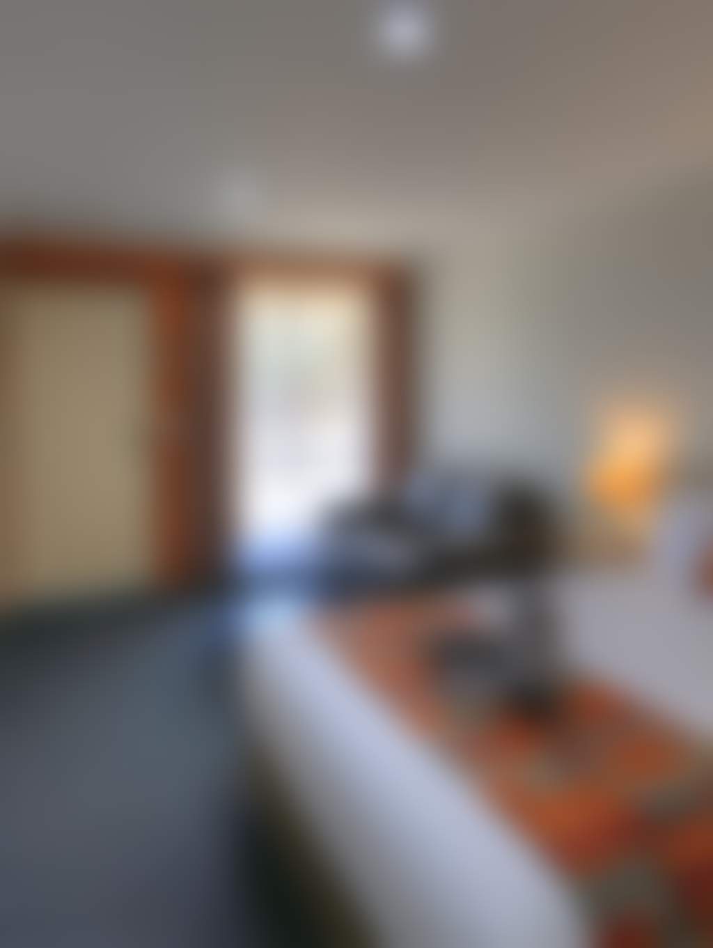 Large comfortable queen room with TV, couch and Desk