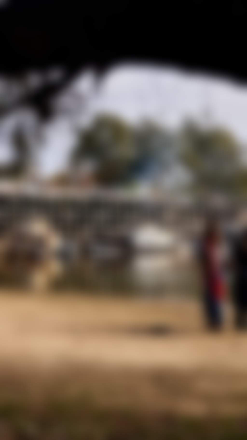 Two women walking around Echuca Wharf
