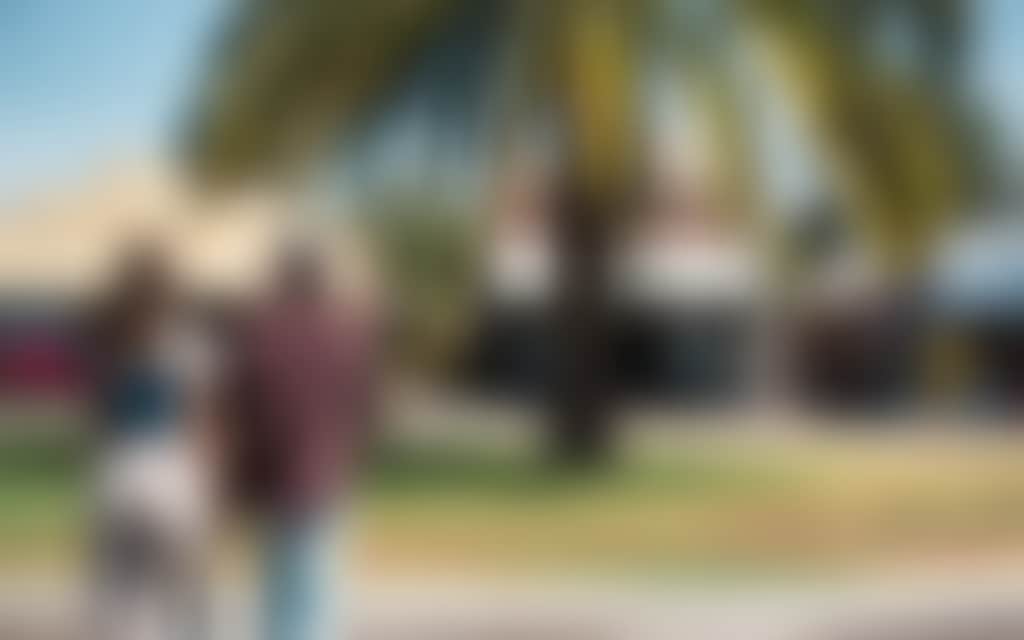 Resized Couple walking through Rochester town centre on a sunny day