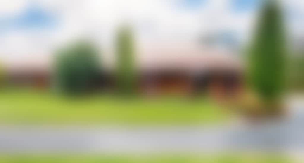 Exterior of Motel in garden surrounds